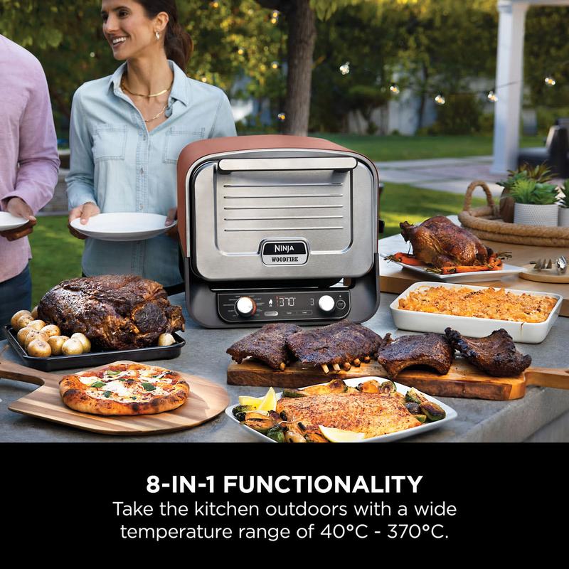 Ninja Woodfire Electric Outdoor Oven + Cover + Pizza Peel Bundle, 8-in-1 Pizza Oven, High-Heat Roaster & BBQ Smoker with Roast Rack, Pro-Heat Tray, Pizza Stone, Wood Pellets & Scoop, 6 Pizza Settings, Burnt Orange OO101UK